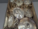 a box with a lot of silver items in it