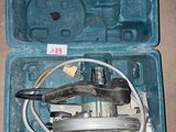 a tool in a case that is sitting on the floor