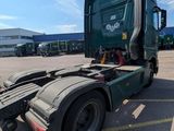 a semi truck that is parked in a parking lot