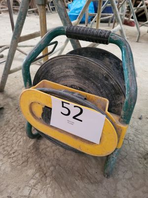 a small cart with a number on it in the dirt