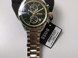 the watch is sitting on the table with a tag attached to it