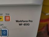 a close up of a workforce pro printer on a table