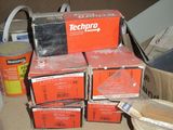 a pile of boxes and tools sitting on the floor