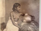 an old photo of a woman with a pot in her hand