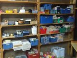 a room that has a lot of shelves and bins in it