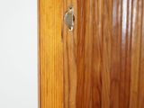 a hole in the door of a wooden door