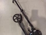 a scooter that is sitting on the floor in the garage