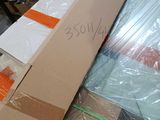 a large box with a sign on it sitting on top of a pile of boxes