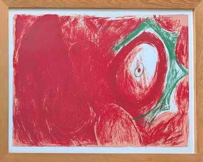 painting of a red apple in a wooden frame on a white wall