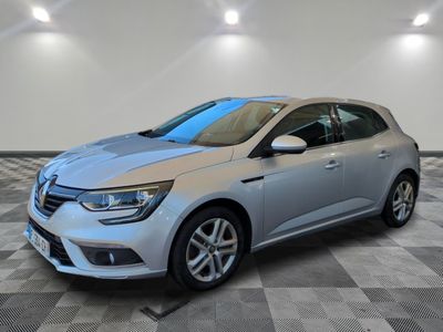 a silver car parked in a room with a checkered floor