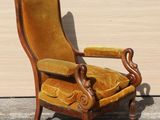 a chair that is sitting in front of a wall