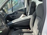 a white van with black seats in the back of it