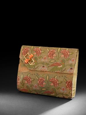 an image of a small purse with a flower pattern on it