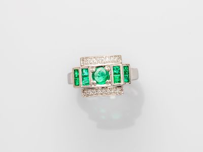 an emerald and diamond ring