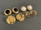 six pairs of gold tone earrings and rings