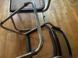 two chairs that are sitting on a hard wood floor