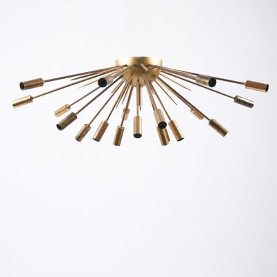 an image of a gold chandelier hanging from the ceiling