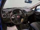 dashboard of a small car with a steering wheel and dashboard controls