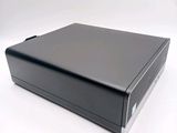 an image of a black box sitting on top of a white table