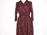the dress is red and black with a pattern on it