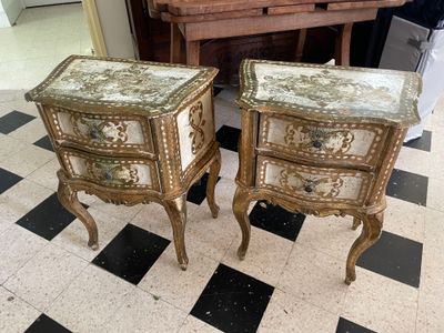 two tables that are sitting on a checkered floor