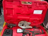 a red tool box with tools in it on the floor