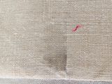 an image of a close up of a piece of fabric with a red stitch