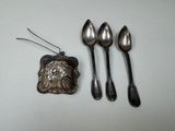 three spoons and two spoons sitting next to each other