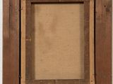 a close up of a picture frame hanging on a wall