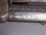 a close up of a gun that is on a table