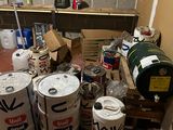 a room with a bunch of barrels and cans on the floor