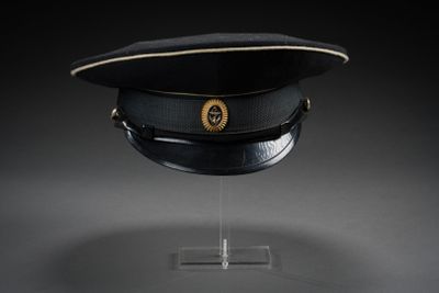 an image of a black hat with a gold emblem on it