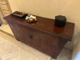 a wooden table with a bowl of sushi on top of it