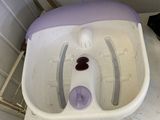 a white toilet with a purple seat in a bathroom