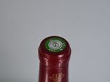 a bottle of wine that is sitting on a table