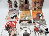 the covers of the manga books are lined up on the table