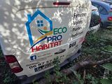 a white van that is parked in the grass