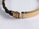 gold plated bracelet with black leather cord and brass clasp