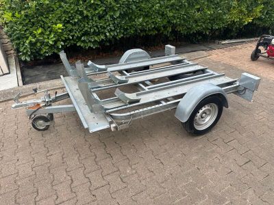 a trailer with a trailer attached to it on the street