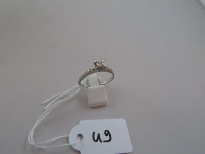 a ring on a string with a price tag attached to it