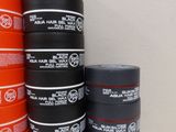 several stacks of black and orange cans stacked on top of each other