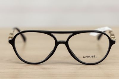 a close up of a pair of glasses on a table