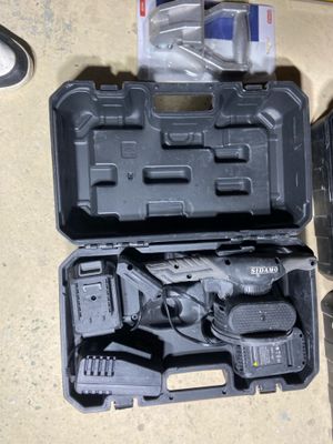 a tool kit that is sitting on the floor next to a pair of shoes