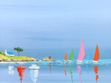 many sailboats that are floating in the water