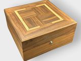 a wooden box that has a wooden lid on it