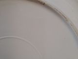 a white plate with a black design on it