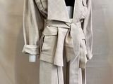an image of a mannequin wearing a coat and skirt