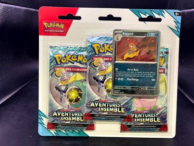 two pokemon trading cards in a package on a black surface