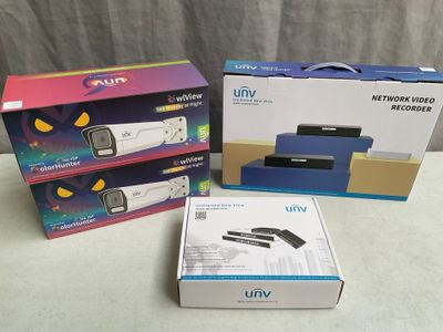 three boxes of different sizes and colors of a camera