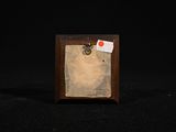 a picture of a small wooden frame with a piece of paper attached to it